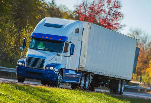 Truck driving down the road, clearinghouse services, FMSCA drug testing